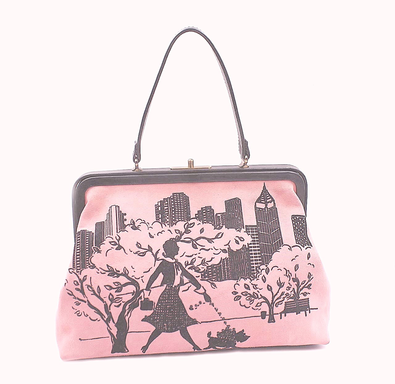 Isabella Fiore pink suede Handbag depicting a woman strolling through a park with a small dog on a leash.