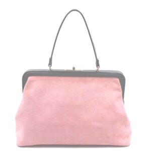 Isabella Fiore pink suede Handbag depicting a woman strolling through a park with a small dog on a leash.