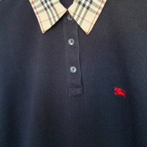 Burberry London Women black check collar sweater front view showing collar and buttons and red log emblem