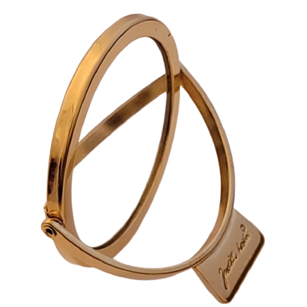 Name view of Judith Leiber name on gold tone double sided purse mirror